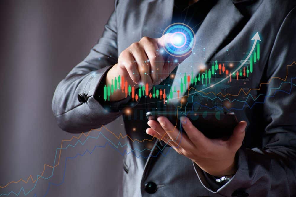 BusinessmanPlanningToInvestInStockMarketManTouchingSuccess